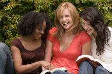 women enjoying a book